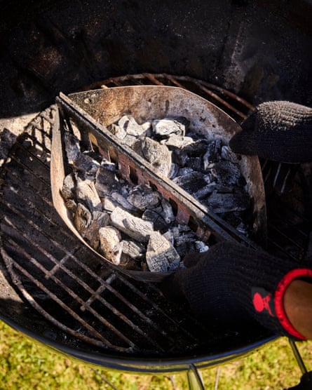 a view of a barbecue with coals