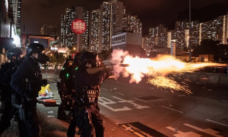 Riot police fire teargas at protesters in Hong Kong