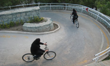 Iranian women ride their bikes at Tehran’s ‘Mothers’ Paradise’ park, the Iranian capital’s women-only public recreation area. 