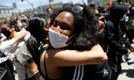 Protesters embrace during a rally in San Francisco on Monday.