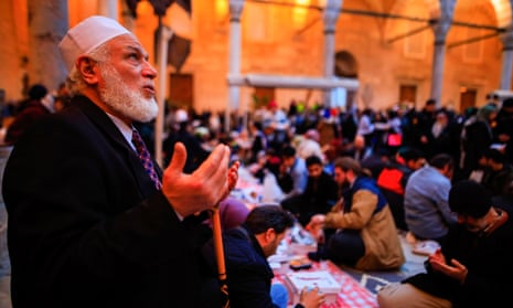 A cleric prays for the children of Gaza before iftar at Eminonu Mosque after a march against the Israeli occupation and demanded freedom for Palestine organized by the Turkish activists in Sultanahmet Square. Demonstrations in Istanbul for Palestine, 28 Mar 2024.