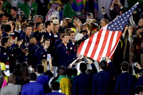 Flagbearer Michael Phelps and Ibtihaj Muhammad lead out the US.