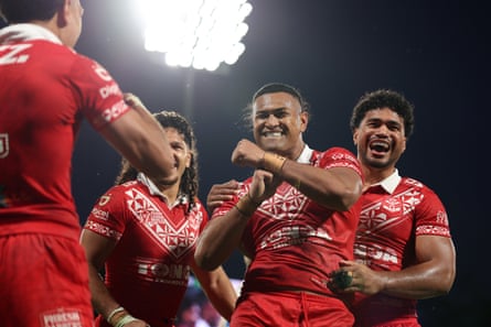 Haumole OlakauâÂÂatu celebrates a try for Tonga