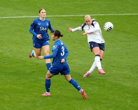 The Tottenham player Cathinka Tandberg (right) shoots from deep, eventually scoring from 40 yards, while two Everton players look on.