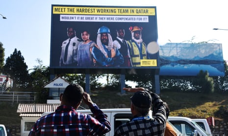 A billboard at Kathmandu airport calls on Fifa to compensate workers for their time in Qatar.