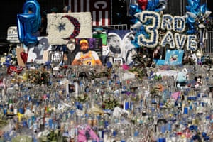 A makeshift memorial is filled with candles for Nipsey Hussle outside his Marathon clothing store in Los Angeles.