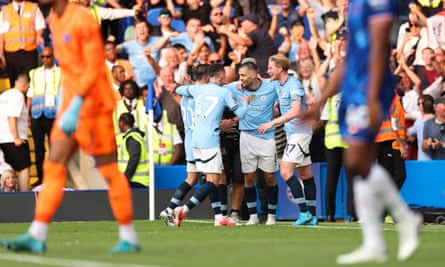 Mateo Kovacic celebrates with his teammates after scoring Manchester City’s second goal.