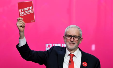 Jeremy Corbyn holds up the Labour party manifesto at the launch in Birmingham.