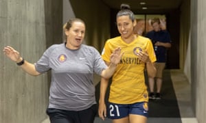Utah Royals manager Laura Harvey speaks to Christen Press in August 2018.
