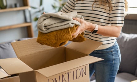 woman puts donations in a box