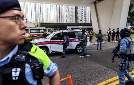 Police outside the west Kowloon court after Hong Kong media mogul Jimmy Lai arrives for his national security trial on 15 August.