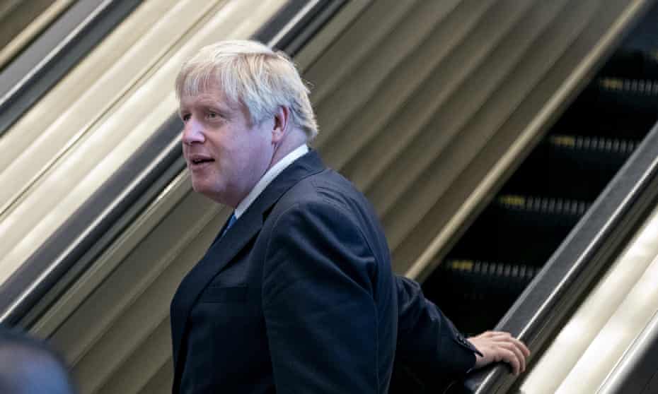 Boris Johnson  on an escalator