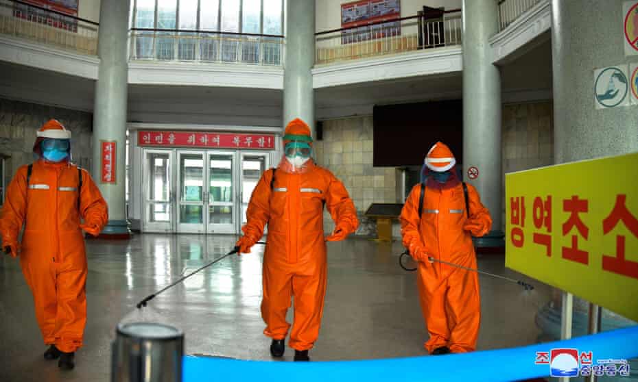 Staff disinfect Pyongyang train station during North Korea’s campaign against Covid