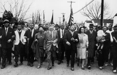 Coretta Scott King and her husband lead a black voting rights march from Selma, Alabama.