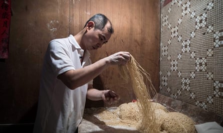 Lau Fat-cheong makes noodles in the old-fashioned way.