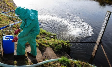 An Environment Agency worker treating the River Trent at Yoxall, Staffordshire