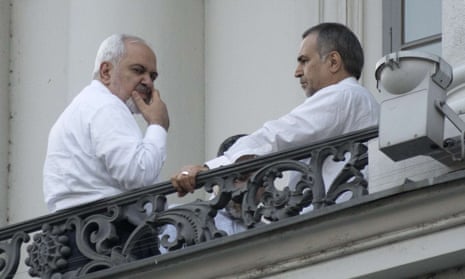 Iran’s foreign minister, Mohammad Javad Zarif (l) takes a break from the negotiations at the Palais Coburg hotel, in Vienna.