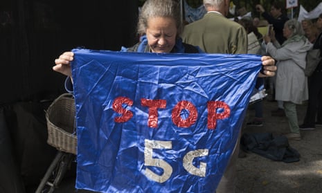 A protester marches against 5G technology in The Hague, the Netherlands.