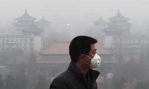 A man wears a mask to protect himself from air pollution in Beijing on 8 December.