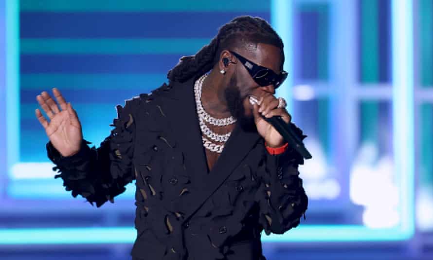 Burna Boy performs on stage.