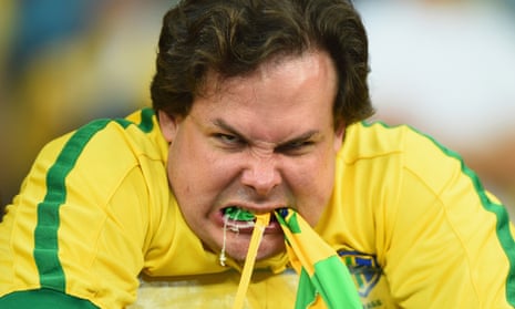 A Brazil fan reacts after their 7-1 demolition by Germany.