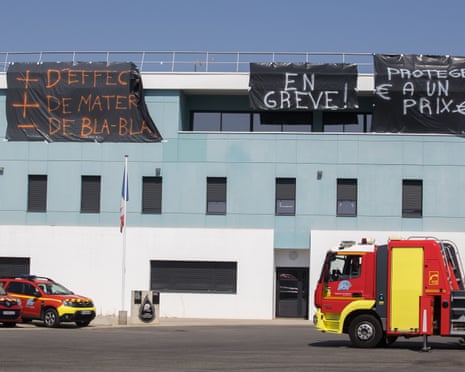 Demands are displayed on banners hung on the facade of the Atlanta fire station in Toulouse, southern France.