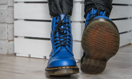 Woman tries on her new pair of Dr Martens 1460 Air Wair blue leather boots