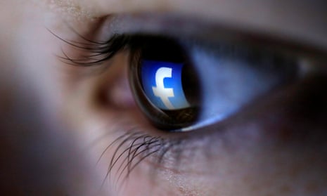 an eye with the facebook logo reflected