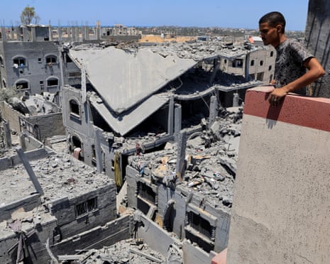 A Palestinian inspects the damage on houses destroyed during an Israeli military operation, in Deir al-Balah, central Gaza Strip, on Wednesday, 23 July 2025.