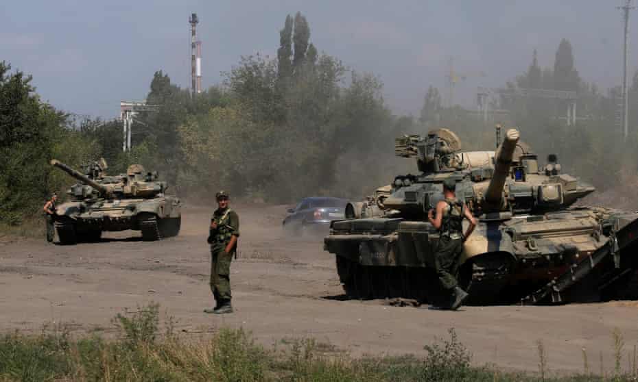 Russian soldiers next to tanks in Kamensk-Shakhtinsky, Rostov region, near the border with Ukraine. The US says Russia’s actions in Ukraine are ‘worrisome’ and pose a threat to America.
