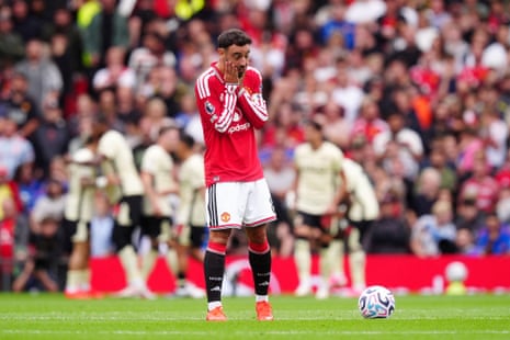 Bruno Fernandes holding his head in his hands