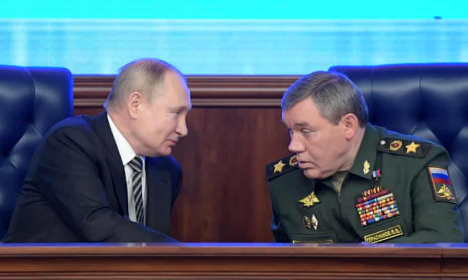 Putin with the commander of the Russian armed forces, Gen Valery Gerasimov in December 2021.