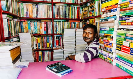 Man selling used books at the largest second-hand book market in the world on College Street in Kolkata, India.