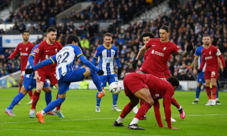 Brighton's Kaoru Mitoma fires past Alisson as Liverpool's Darwin Núñez tries to block the shot