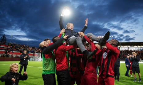 Graham Potter is borne aloft by his Ostersund players after reaching the group stage of the Europa League in August by beating PAOK