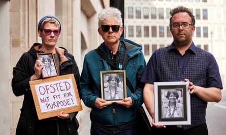 Members of Parents against Ofsted hold photographs of Ruth Perry outside the Department for Education, while members of the NEU hand in a petition calling for Ofsted to be replaced with a school accountability system. (Left to right) Amanda Bentham, a former teacher from London, James Denny, who lives near Caversham primary school, and George Binette, seen on 23 March 2023.