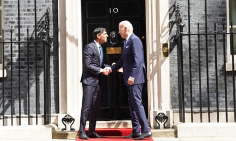 Joe Biden and Rishi Sunak shake hands at the door of Number 10.