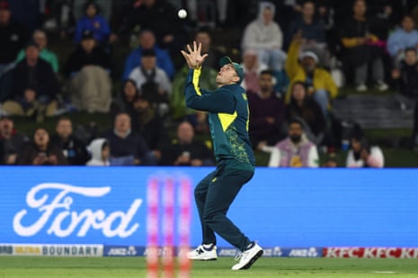 Mitchell Marsh takes the catch to dismiss Devon Conway.