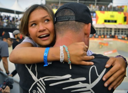 Sky Brown hugs her father after coming third in the World Park Skateboarding Championship in Sao Paulo on September 14, 2019