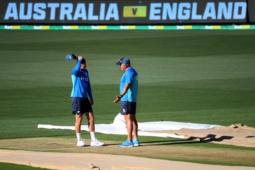 England’s captain Joe Root (left) chats with coach Chris Silverwood prior to the Adelaide Test