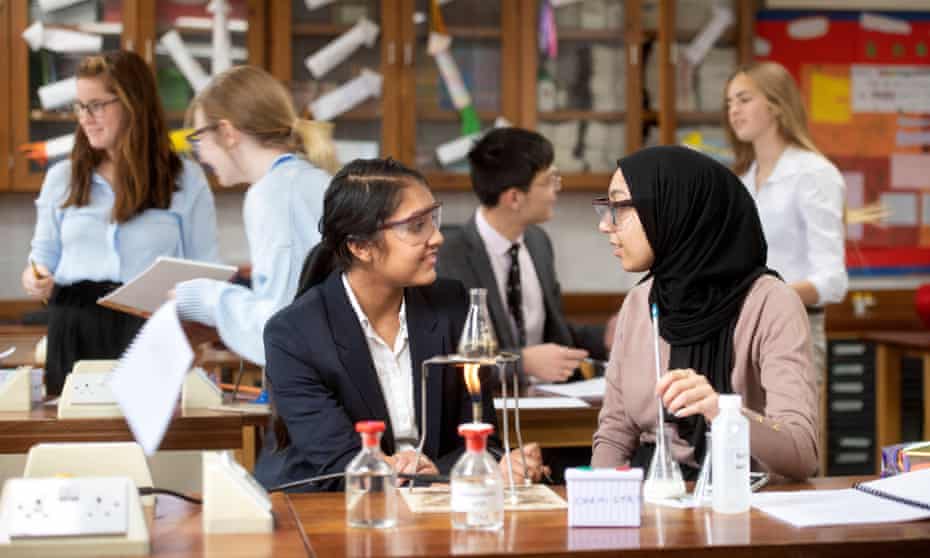 A-level chemistry students during a practical lesson in a secondary school.