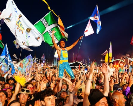 The audience watching Elton John performing on the Glastonbury Pyramid Stage in 2023.