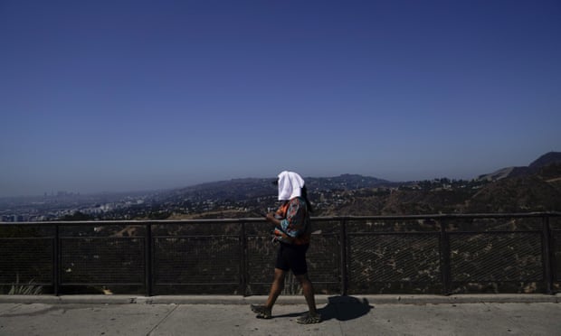 A woman at the Griffith Observatory in Los Angeles on Tuesday. The NWS said the heatwave could continue through Friday.