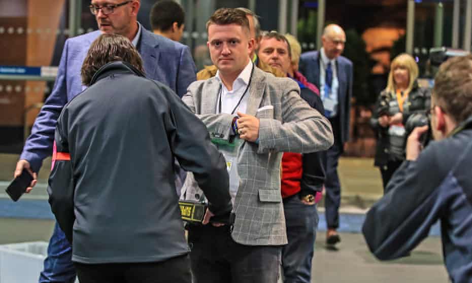 Tommy Robinson goes through a security check on arrival for the election count in Manchester
