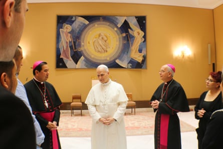 men in religious vestments speak