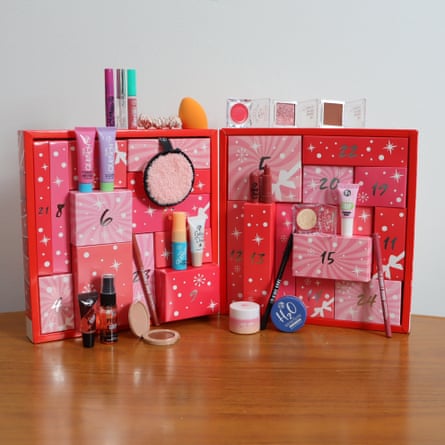 W7 Beauty Blast makeup Advent calendar open on a table, with its beauty products arranged alongside it