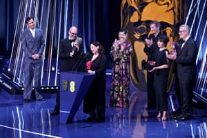 Edward Berger, Tessa Ross, cast and crew accept the best film award for Conclave