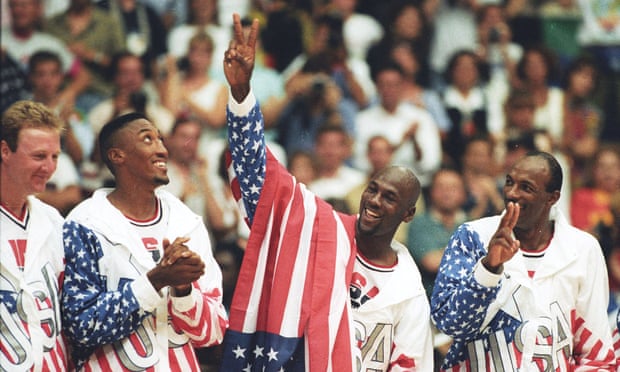 Michael Jordan flashes a victory sign as he celebrates with teammates Larry Bird, Scottie Pippen and Clyde Drexler after winning the Olympic gold in Barcelona in 1992.