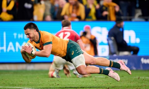 Tom Wright scores the decisive try for the Wallabies.