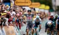 Alpecin-Deceuninck’s Jasper Philipsen celebrates as he crosses the line ahead of his sprint rivals.